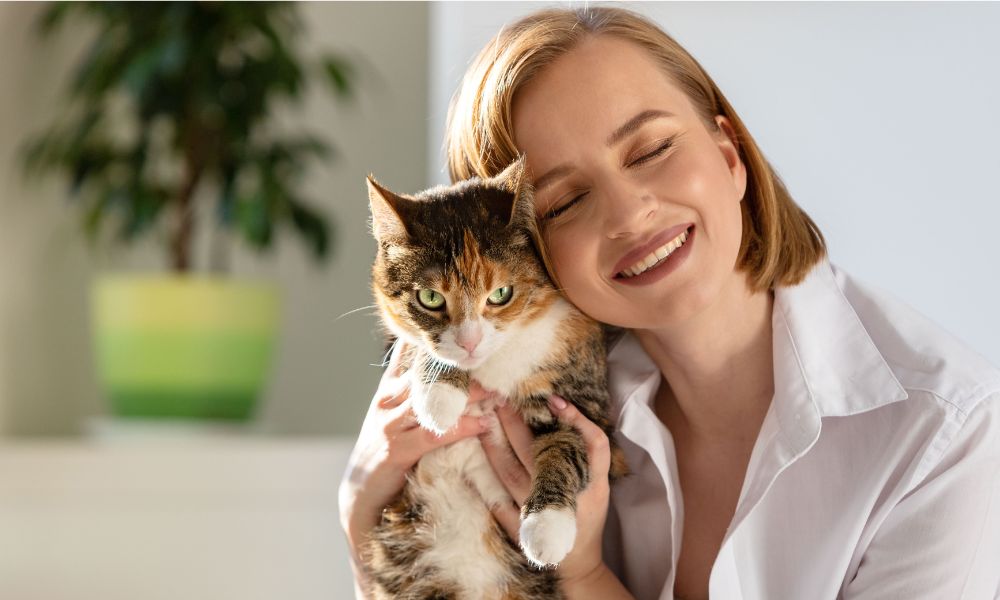 Cat Cremation Bristol - Woman Hugging a Pet Cat - Companions Haven Ltd
